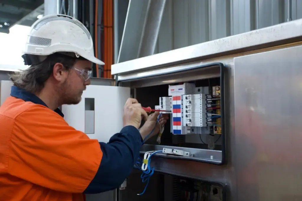 TECS technician wiring a panel at the Quattro Ports grain terminal